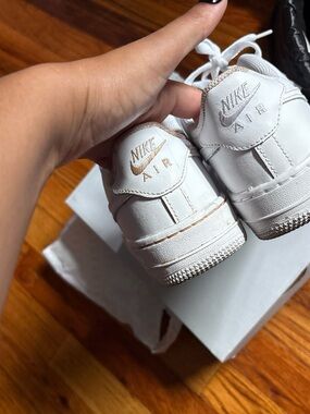 Nike White Leather Air Sneakers with Gold Logo